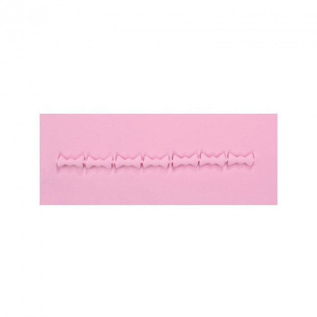 Motif realise avec la pince de marquage noeud papillon